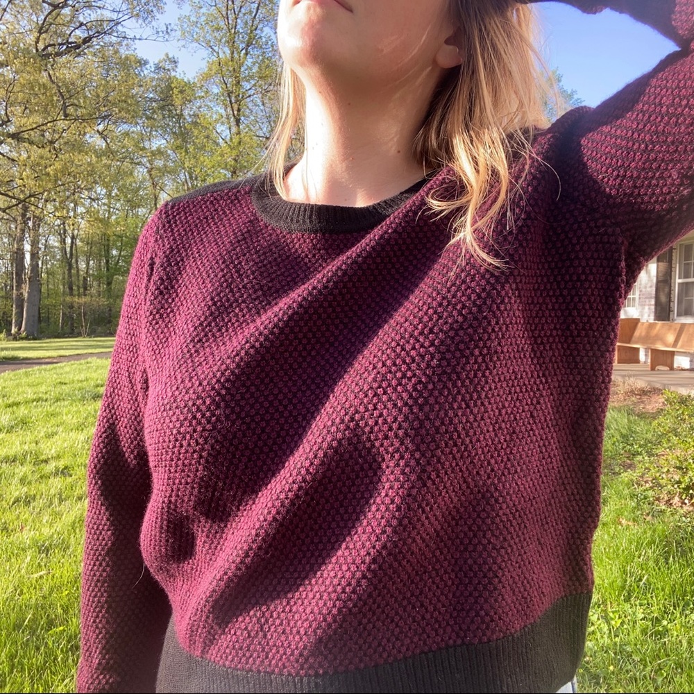 Wine and black sweater